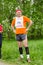Man getting ready for running competition among elderly athletes