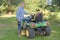 Man getting on ride on mower