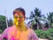 A man getting showered with holi colours during holi festival in india