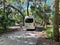 A man getting into a van to back it into a campsite at Trimble Park in Mount Dora, Florida