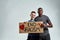 Man and girl holding placard with anti racist quote