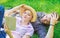 Man and girl lay on grass reading book. Family enjoy leisure with poetry or literature book grass background. Couple