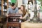 Man with girlfriend admiring vintage wooden bureau