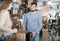 Man with girlfriend choosing vintage bedside table