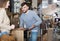 Man with girlfriend choosing vintage bedside table