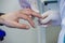 Man gives blood. Blood is taken from a man for analysis from a finger in a specialized medical laboratory. Treatment