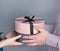 Man gives gift to girl. Round box with gift in hands of couple