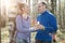 Man gives to the woman a bouquet of snowdrops in a birchwood in the spring, toning