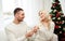 Man giving engagement ring to woman for christmas