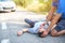 Man giving first aid in car accident