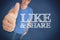 Man giving his thumb up next to like & share