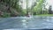 Man gliding through water slide