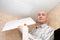 Man glues ceiling tile