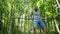 Man goes in for sports doing pull-up exercises on horizontal bar outside. Male