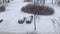 Man goes to his car and starts brushing off the snow. Time lapse video.