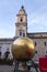 Man on the golden ball statue, modern art titled Sphaera by Stephan Balkenhol at the Kapitelplatz, Salzburg, Austria