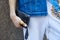 Man with golden skull ring and white sport trousers before Les Hommes fashion show, Milan Fashion Week street