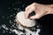 Man grabbing some rice grains