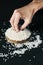 Man grabbing some rice grains