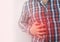 A man grabs his right side under the ribs. Pain in the liver. Pain syndrome in liver disease