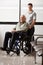 Man With Grandfather Sitting In Wheelchair