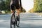 Man on a gravel bike on the road, back view.