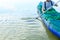 A man on a green inflatable kayak on the lake rowing