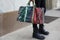 Man with green and red sequin large bag before Cristiano Burani fashion show, Milan Fashion Week street style