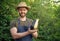 man greengrocer presenting eggplant and vegetable marrow