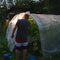 Man and a greenhouse