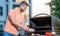 Man grilling steaks to perfection on smoky barbecue. Grilling man cook meat at barbecue. Grill sizzles with flavor