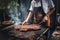 A man grills juicy pork ribs, fried meat with a golden crust, selective focus. May holidays concept barbecue, party