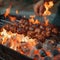 Man grills shish kebab over flames, sizzling with deliciousness