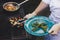 man grills some kind of vegetable on gas grill during summer time