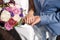 The man the groom keeps the girl`s hand. Colorful bridal bouquet. wedding day, bride accessories