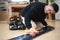 A man grooming a snowboard board