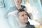 Man at hairdresser salon hairstyle make model