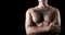 Man with hairy chest isolated on black background for text.