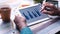 Man hand analyzing chart on digital tablet at office desk