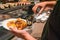 Man hand choosing lobster in the luxury buffet