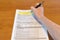 Man hand filling Polish individual income tax form PIT-36L.