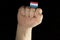 Man hand fist with Luxembourg flag isolated on black background