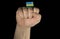 Man hand fist with Rwandan flag isolated on black