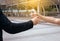 Man hand giving bottle of drinking water after running exercise at the street