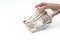 Man hand grabbing Japanese 10000 banknote in shopping basket on white background