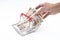 Man hand grabbing Japanese 10000 banknote in shopping basket on white background