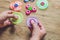 A man hand holding hand spinner or fidget spinner over wooden background