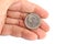 Man hand holding an old Spanish coin of 50 pesetas