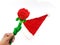 Man hand holding the phony red rose with green stalk above santa