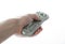 Man Hand holding a TV remote control over white